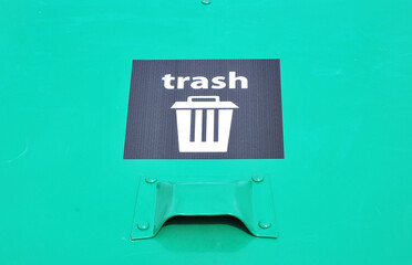 Trash recycle bins displayed outdoors.
