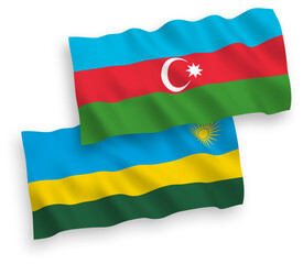 Obraz premium National vector fabric wave flags of Republic of Rwanda and Azerbaijan isolated on white background. 1 to 2 proportion.