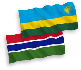 Obraz premium National vector fabric wave flags of Republic of Rwanda and Republic of Gambia isolated on white background. 1 to 2 proportion.