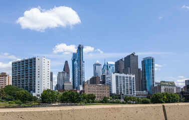 Fototapeta premium View of Downtown Philadelphia, Peninsulvlenia on a mostly sunny summer day from the freeway.