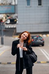 Young woman with a backpack on the road