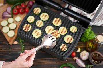 cooking at home on electric grill - zucchini and eggplant