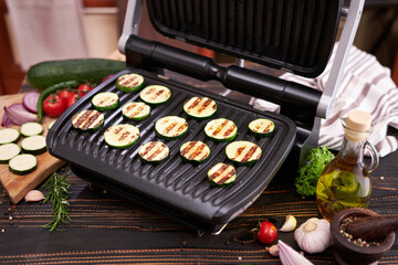 cooking at home on electric grill - zucchini and eggplant