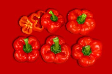 red and yellow peppers, red background