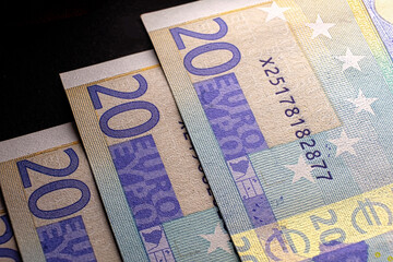 Three 20s euro banknotes macro background