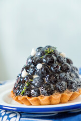 Homemade blueberry tart with soft cheese