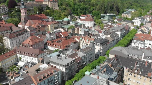 Panning drone shot of the town of Baden Baden full of colourful multi story mansions