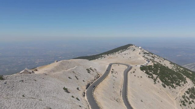 Dolly forward drone shot of the east side of Mont Ventoux with the Radome and Chapelle Sainte-Croix