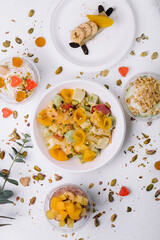 plate of fresh fruit salad and ice cream with jelly and nuts