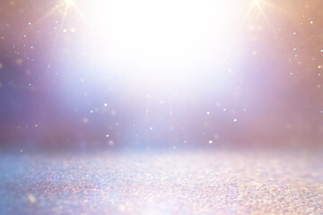 background of abstract gold, pink, purple and silver glitter lights. defocused