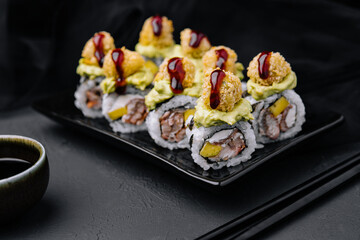 set of rolls on stone serving board