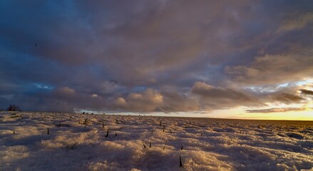 Dark clouds on snowy scene