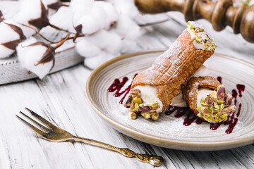 Traditional italian dessert cannoli siciliani on plate