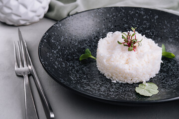 Portion of classic italian risotto on black plate