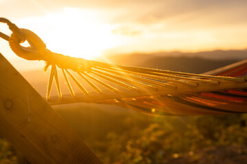 Empty hammok hanging in the mountains in summer