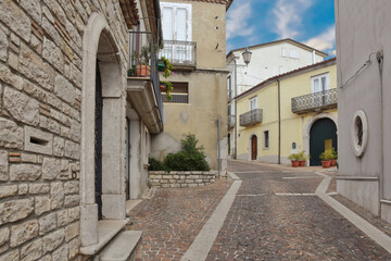 Fototapeta premium A small street between the houses of Frigento, a rural village in the province of Avellino in Italy. 