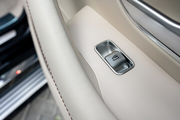 Front handle door panel with buttons of a luxury car