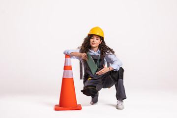 Woman holding traffic cone. Portrait .