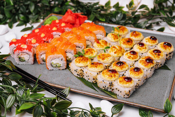 different sushi rolls on a big plate