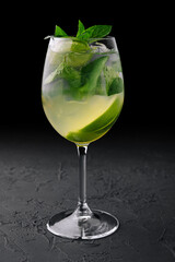 Fresh mojito in wine glasses on stone