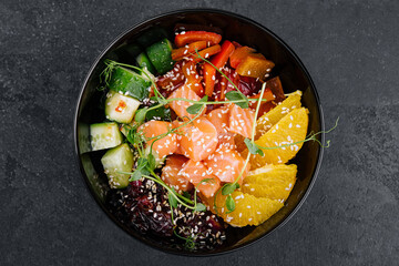 Poke bowl with salmon, cucumber, pepper and orange