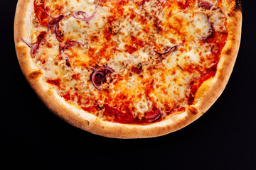 Baked tuna pizza on black background