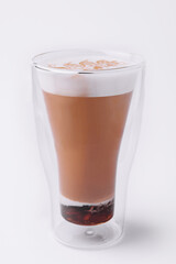 Glass of coffee macchiato with cream foam