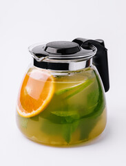 Jug of tasty cold tea on white background