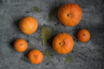 Orange pumpkins are on the table
