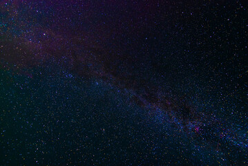 starry multicolored night sky with a bright milky way and galaxies. Astrophotography with many...