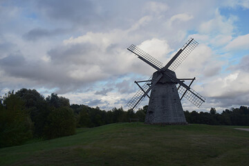 Windmill on a hill close up.