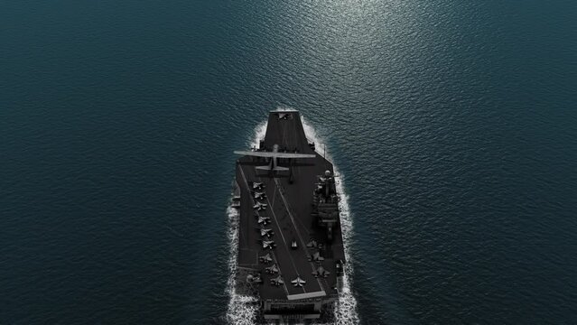 Aircraft carrier crossing the ocean Aerial view
High altitude view of Aircraft carrier in the ocean

