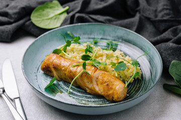 Fried duck fillet with rice on a plate