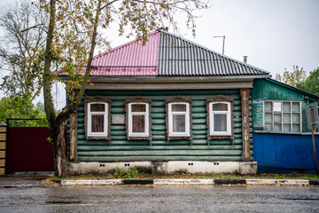 old wooden houses trimmed with wooden lace on the streets of Rostov the Great
