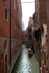 narrow canal view with gondolas, Venice, Italy 