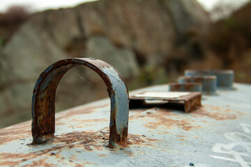 old and rusty iron cistern in a stone quarry