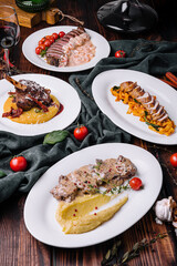 different gourmet dishes for dinner with red wine