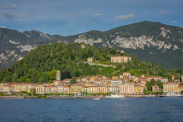 Fototapeta na wymiar Mountains and Bellagio skyline, view from Lake Como at sunset, northern Italy
