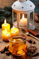 Fototapeta A cup of hot tea among Christmas decorations. Cozy atmosphere. obraz
