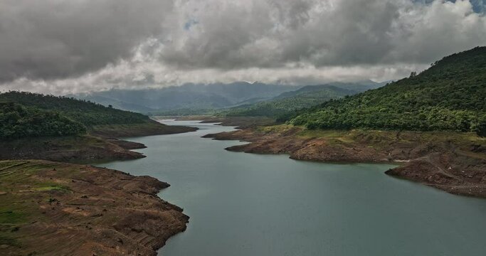 Hornito Panama Aerial v2 cinematic natural landscape capturing beautiful pristine fortuna reservoir, brazo de hornito with dense and dark stormy clouds in the sky - Shot with Mavic 3 Cine - April 2022