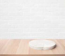 Selective focus.Wood table top with chopping board with brick wall background