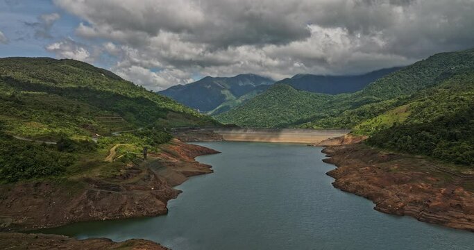 Hornito Panama Aerial v3 cinematic drone reverse flyover fortuna reservoir dam capturing pristine and serene landscape of brazo de hornito river and mountain view - Shot with Mavic 3 Cine - April 2022