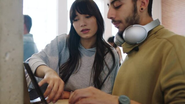 Creative man, woman and laptop teamwork discussion, talking and speaking on software code data at tech startup. Cyber security programmer people in collaboration, cooperation and fix 404 coding error