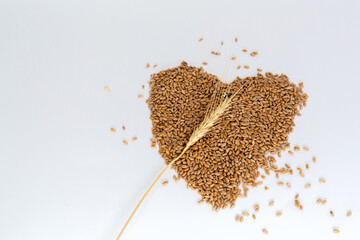 Grains wheat heart shape. White background.