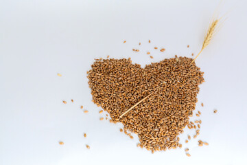 Grains wheat heart shape. White background.