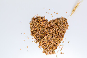 Grains wheat heart shape. White background.