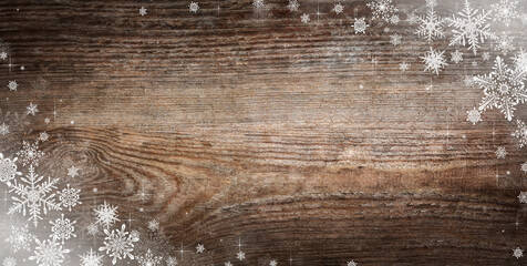 Panorama of vintage Christmas background with snowflakes and stars.