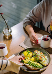 girls have breakfast in a cafe
