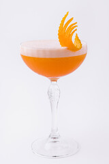 Glass of Ruby Cocktail garnished with orange zest