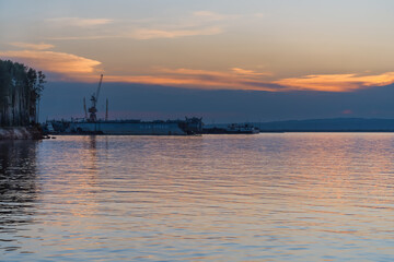 Fototapeta Late evening at the dock on the river. obraz